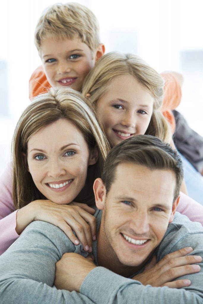 Family posing for a picture stacked on top of each other