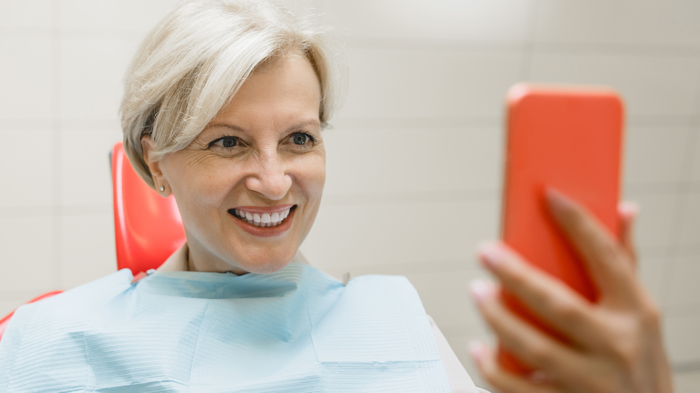 Mature woman with teeth in a day implants