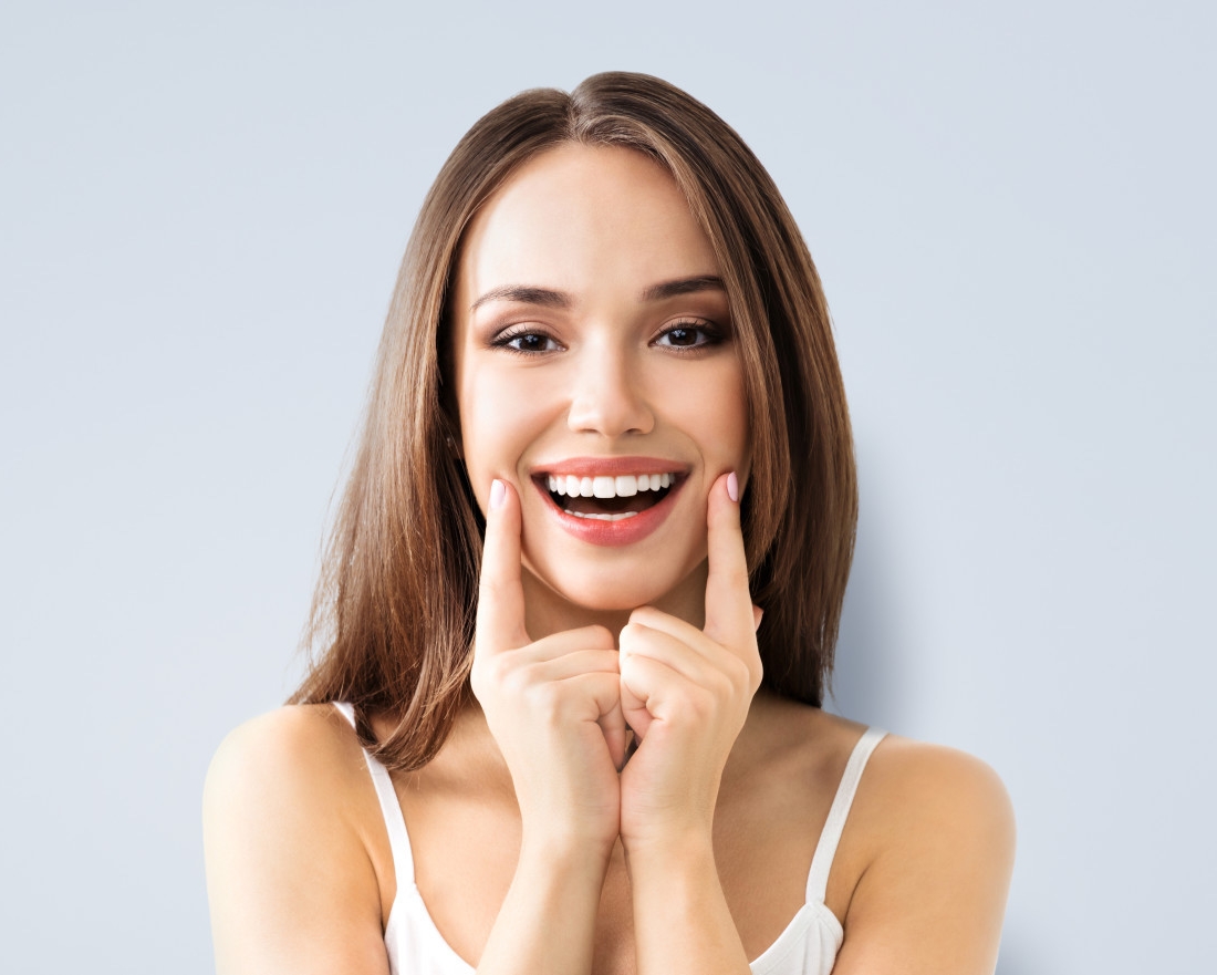 young woman showing beautiful teeth