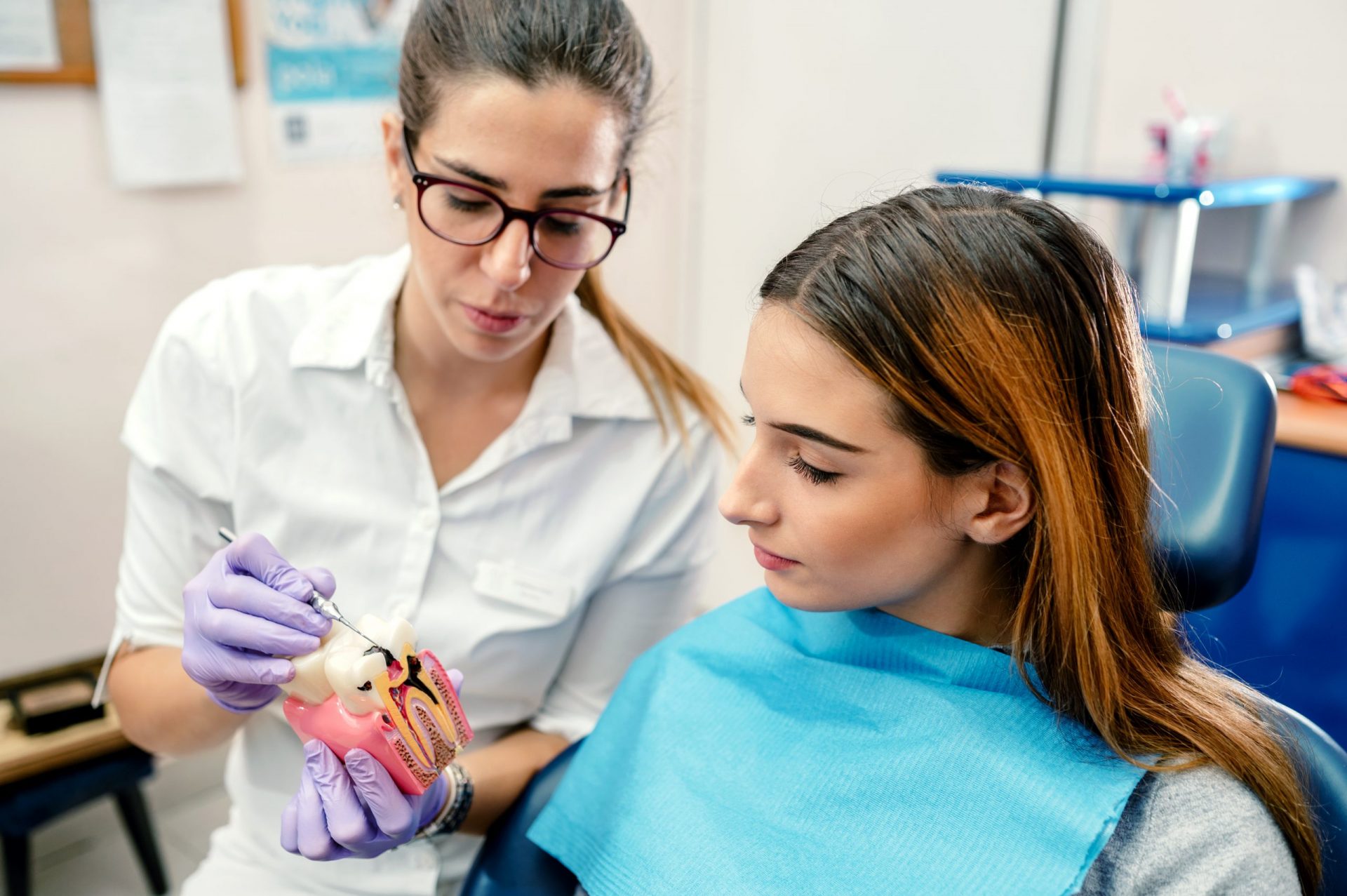 periodontist teaching patient about periodontal disease