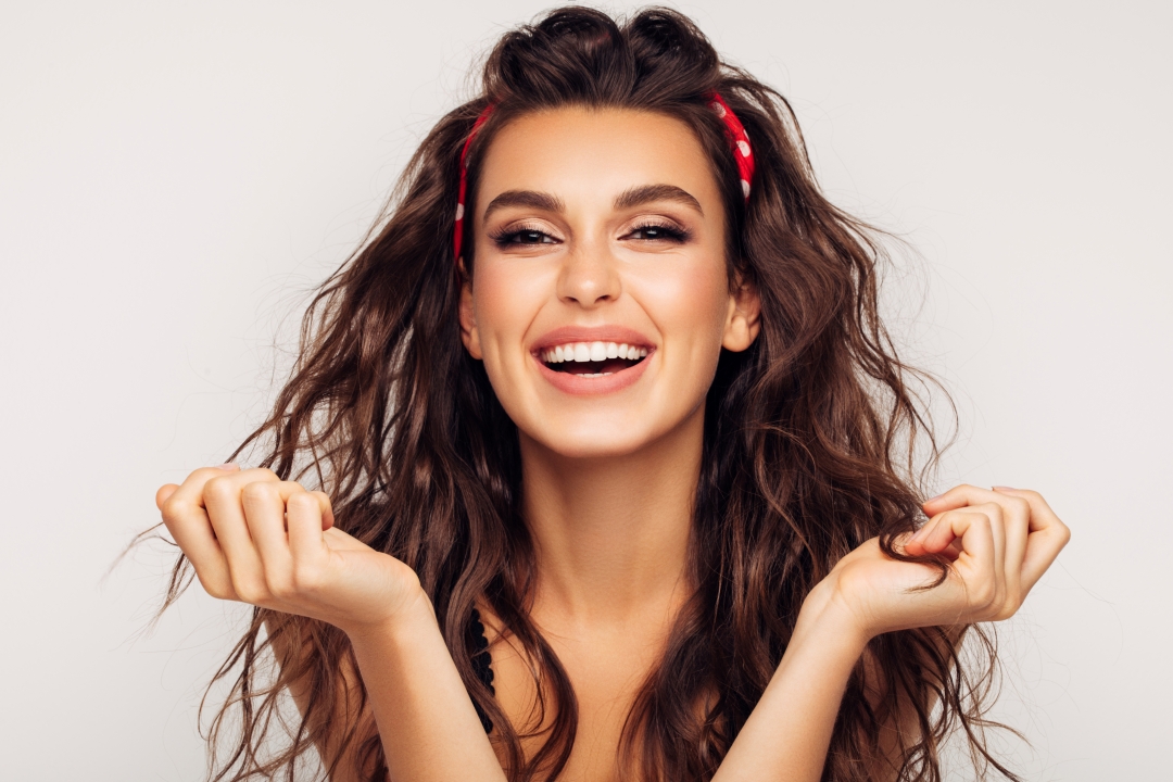 Woman smiling after gum contouring treatment