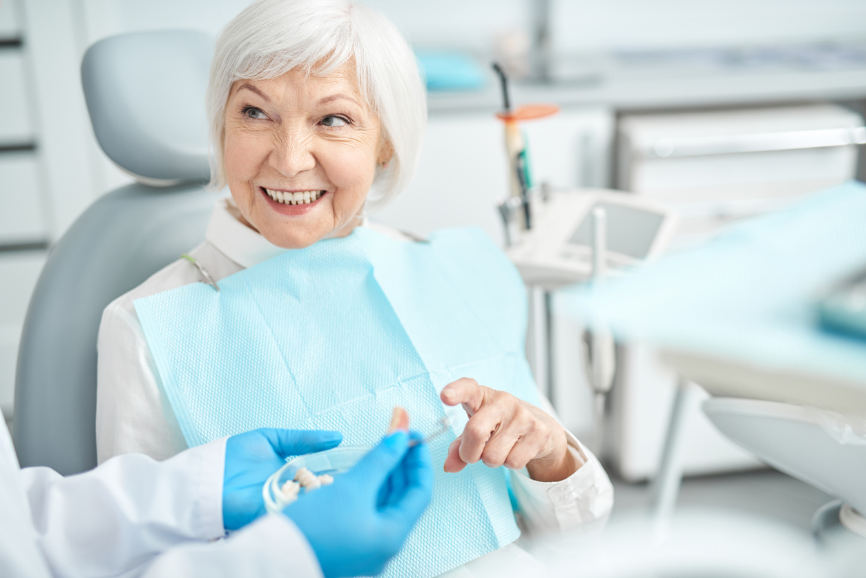 A senior woman getting dental implants