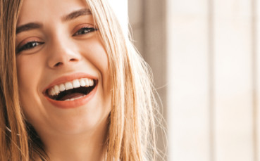 young woman smiling enthusiastically