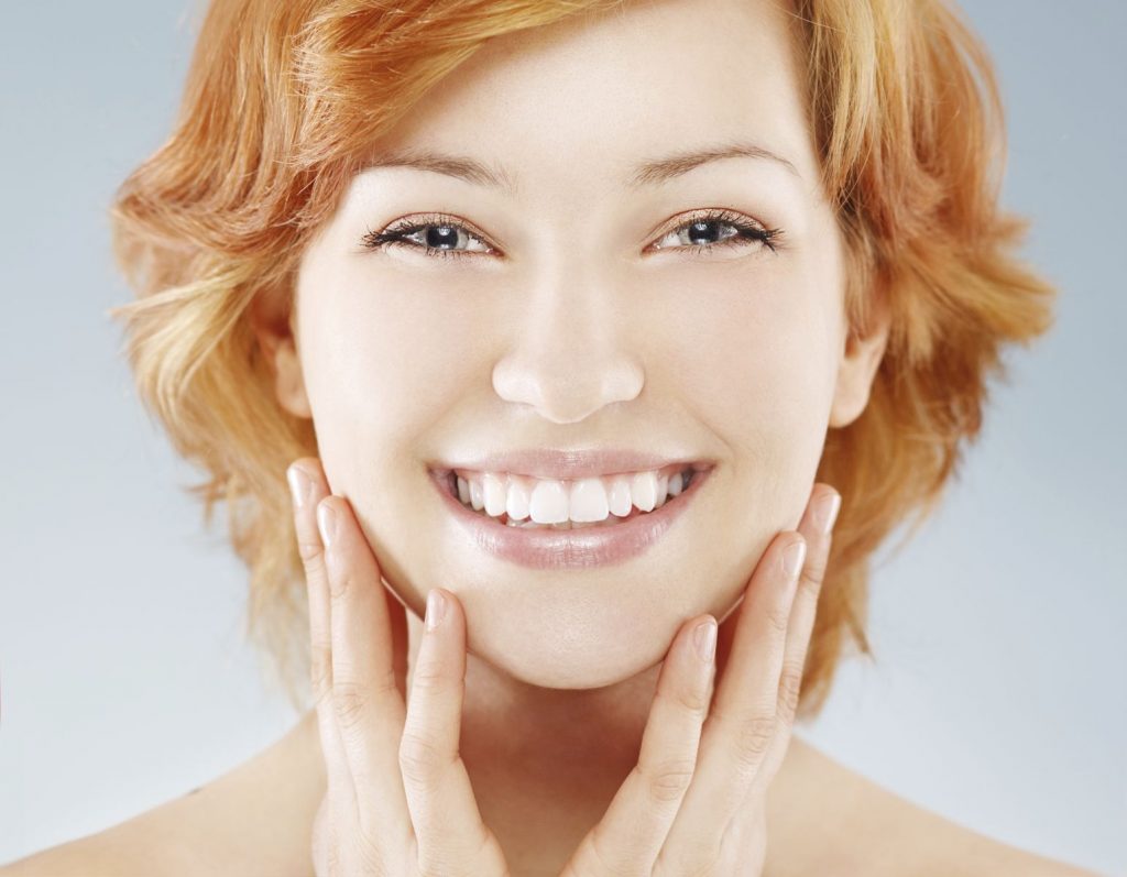 a woman smiling brightly