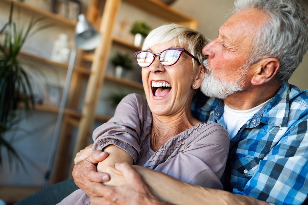 Senior couple happy hugging and kissing