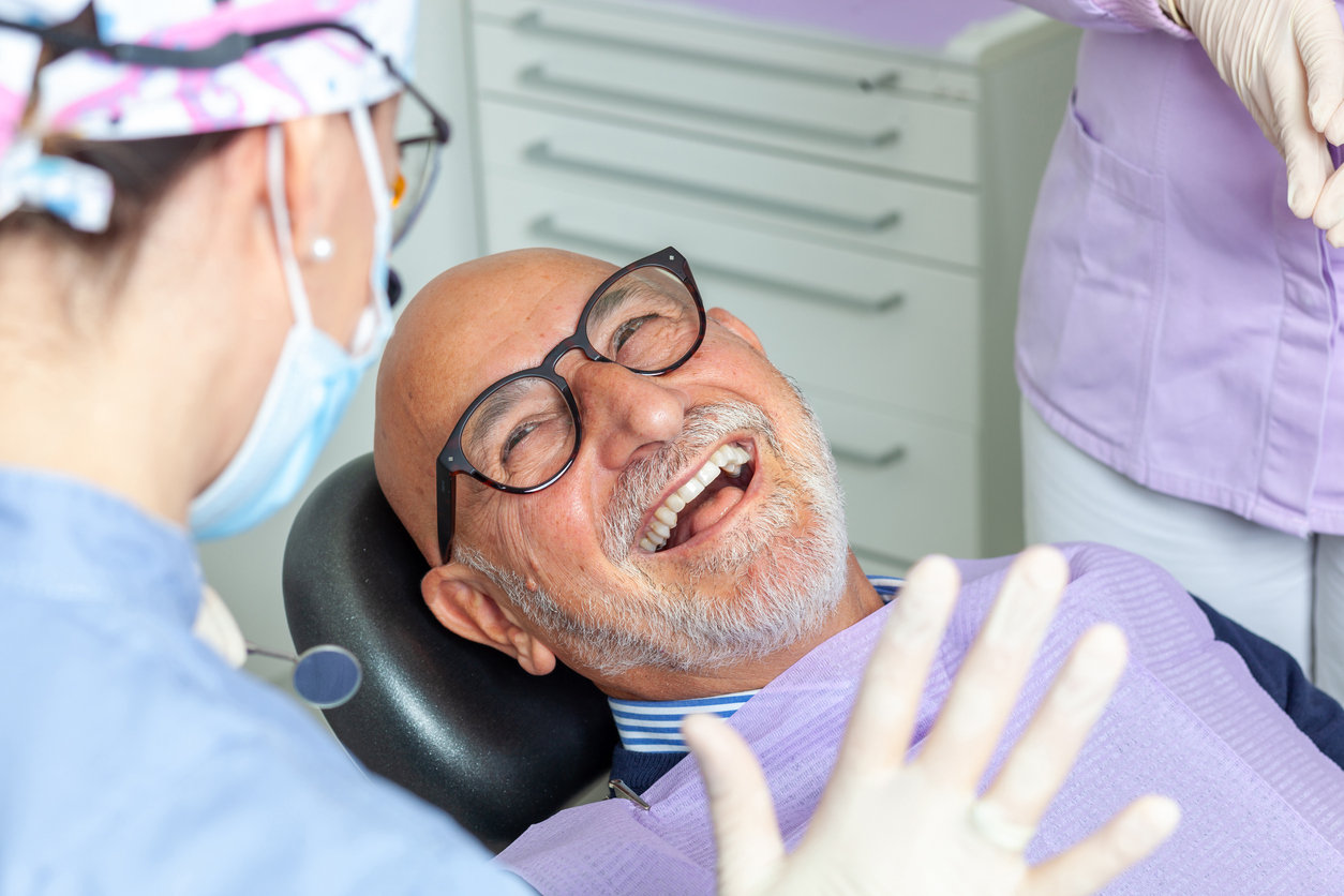 smiling male All-On-4 dental implant patient.