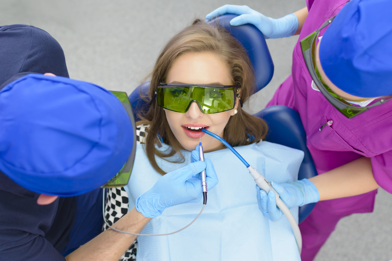 woman getting LANAP laser gum therapy for gum disease treatment